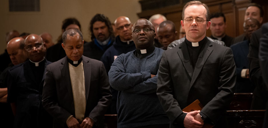 Priests from councils are photographed during a prayer session for vocations