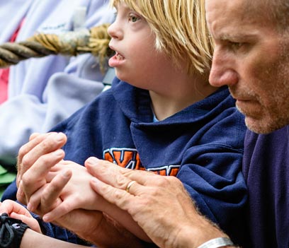 Father with a special needs child attending mass