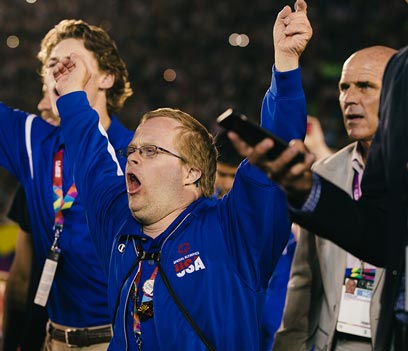 An athlete carrying an unlit torch for the special-olympics