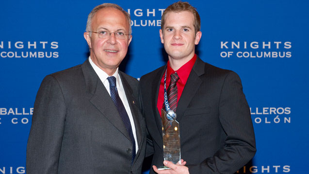 Grand Knight Michael Broussard receives the 2010-11 Youth Activity Award from Supreme Knight Carl A. Anderson on behalf of Cardinal John Henry Newman Council 15105 at the University of Houston, Texas. Grand Knight Michael Broussard receives the 2010-11 Youth Activity Award from Supreme Knight Carl A. Anderson on behalf of Cardinal John Henry Newman Council 15105 at the University of Houston, Texas.