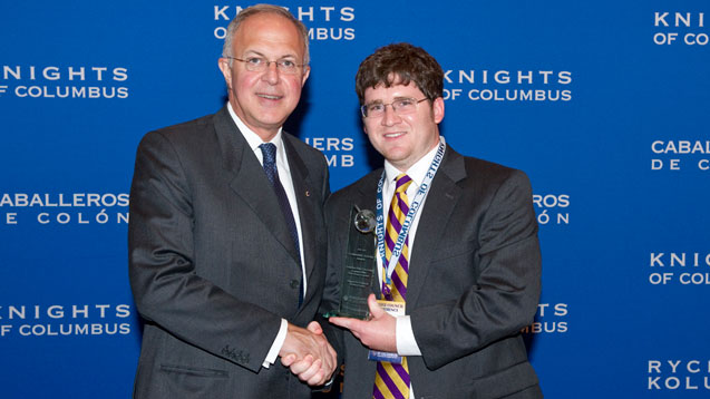 Grand Knight Hudson Breaud of Christ the King Council 15064 at Louisiana State University in Baton Rouge receives the 2010-11 Community Activity Award from Supreme Knight Carl A. Anderson on behalf of his council. Grand Knight Hudson Breaud of Christ the King Council 15064 at Louisiana State University in Baton Rouge receives the 2010-11 Community Activity Award from Supreme Knight Carl A. Anderson on behalf of his council.