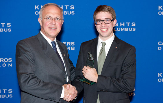 Supreme Knight Carl A. Anderson congratulates Grand Knight Timothy McEvoy of The Catholic University of America Council 9542 in Washington, D.C., for earning the 2010-11 Council Activity Award.