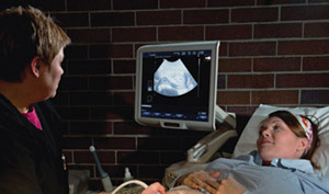 Dr. Michele Krieger performs an ultrasound scan on an expectant mother at Life Choices Pregnancy Center in Kearney, Neb. Dr. Michele Krieger performs an ultrasound scan on an expectant mother at Life Choices Pregnancy Center in Kearney, Neb.