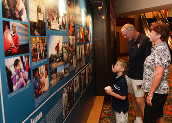 A Knight and his family pause to study a history panel in the lobby of the Wardman Park Marriott hotel in Washington, D.C. The exhibit, chronicling the charitable events of the Knights of Columbus, is on public display for the Order’s annual international convention. A Knight and his family pause to study a history panel in the lobby of the Wardman Park Marriott hotel in Washington, D.C. The exhibit, chronicling the charitable events of the Knights of Columbus, is on public display for the Order’s annual international convention.