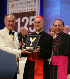 Cardinal Bertone receives the Gaudiumet Spes Award from Supreme Knight Anderson and Supreme Chaplain Lori Cardinal Bertone receives the Gaudiumet Spes Award from Supreme Knight Anderson and Supreme Chaplain Lori