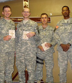 Catholic troops in Afghanistan display Armed With the Faith, a Catholic handbook for military personnel distributed by the Order.