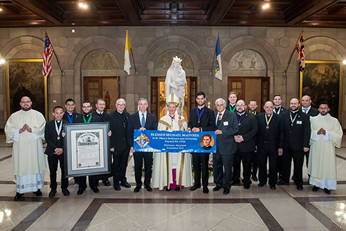 Supreme Knight Patrick Kelly and Supreme Chaplain Archbishop William E. Lori of Baltimore are joined April 26 by Maryland State Deputy Vince Grauso and members of the newly chartered Blessed Michael McGivney Council 17759 at St. Mary’s Seminary & University in Baltimore.