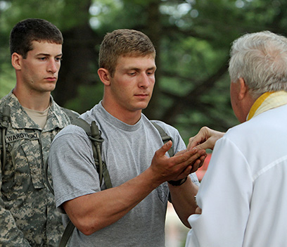 A Catholic Priest Blessing Three Chaplains.