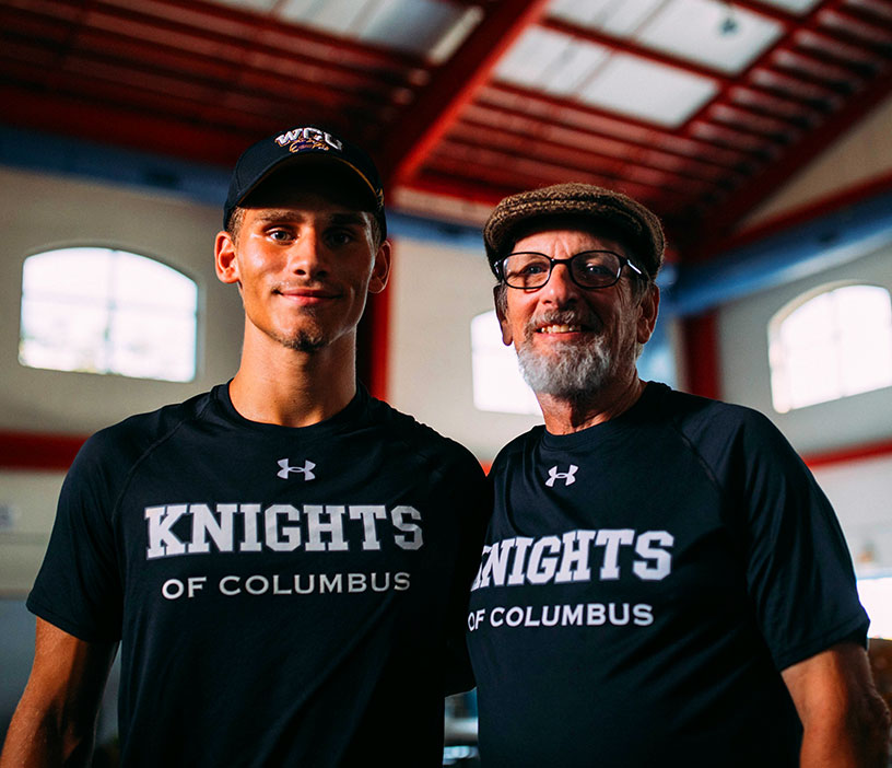Father and Son Knights pausing for a photograph during disaster relief efforts