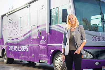 Brandi Swindell stands with the Mobile ultrasound clinic