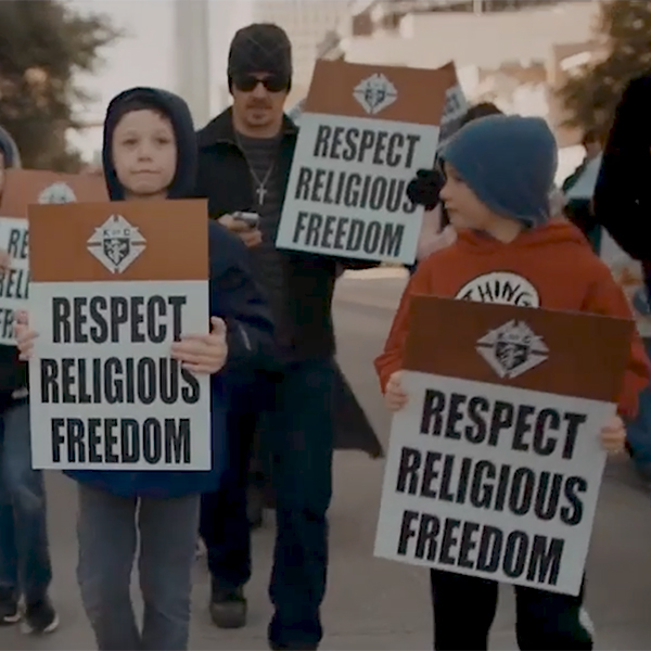 Knight marches with children urging religious freedom Knight marches with children urging religious freedom